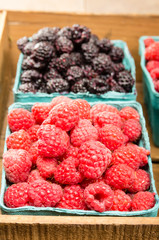 Wooden box with baskets of berries