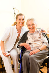 Young nurse and female senior in nursing home