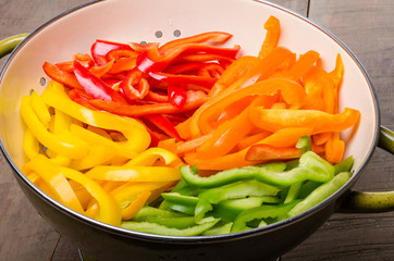 Fresh slices of bell peppers in different colors