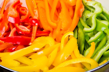 Fresh slices of bell peppers in different colors