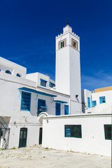 Sidi Bou Said tower in Tunisia, streets and buildings near town
