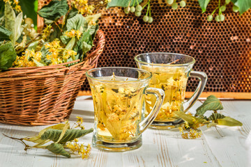 Tea with lime and honey served in the garden at summer