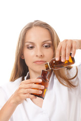 Fototapeta premium woman doctor with medication in glass bottles