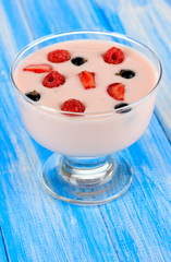 Delicious yogurt with fruit on table close-up