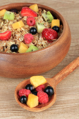 Oatmeal with fruits on table close-up