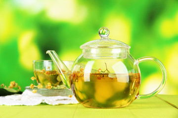 Kettle and cup of tea with linden