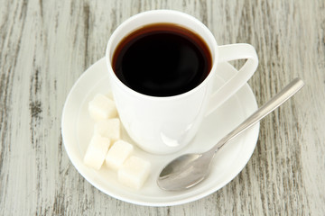 Cup of coffee, on color wooden background