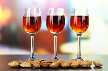 Glasses of amaretto liquor and roasted almonds,
