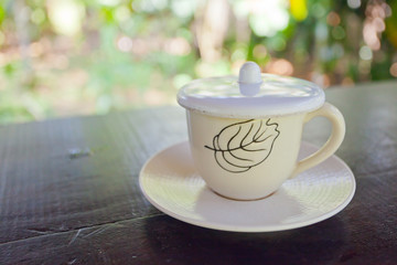 One white cup of aromatic coffee