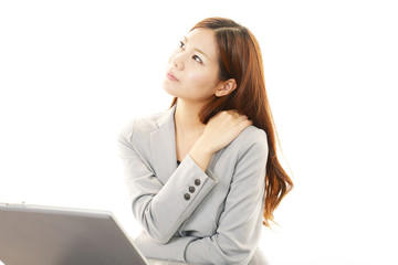 疲れた表情のOL