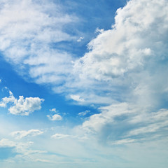 Naklejka na ściany i meble The white cumulus clouds against the blue sky