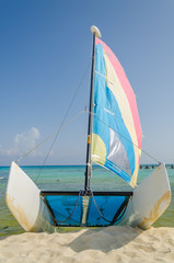 Beached sailing boat on a tropical beach
