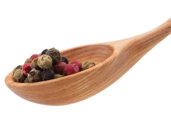 Pepper seasoning  mix in wooden spoon isolated on white backgrou