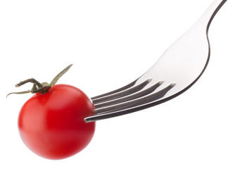 Cherry tomato on fork isolated on white background cutout. Healt