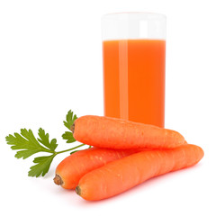 Carrot juice glass and carrot tubers