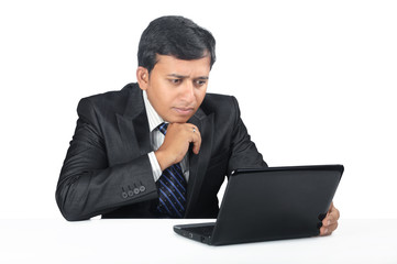 Young Indian business man with Laptop