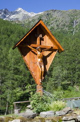 Wooden crucifix on a background of mountains