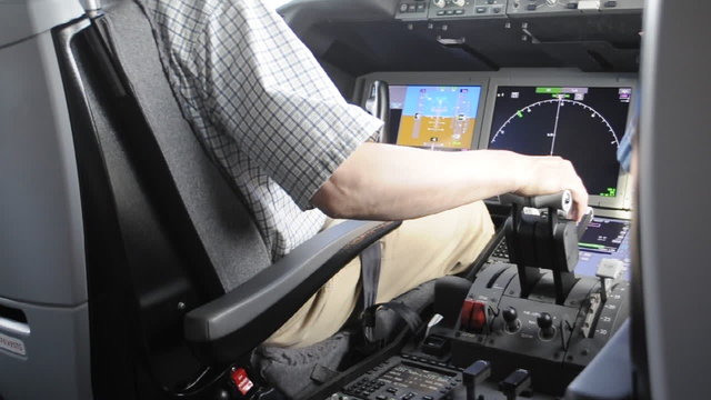 Pilot in the plane cockpit