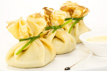 pancakes with meat on a table in a restaurant