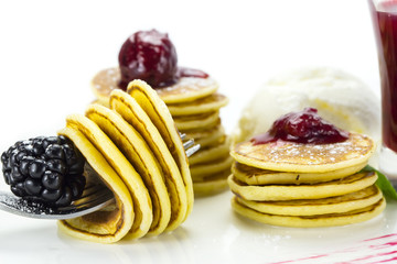 sweet little pancakes with blackberry jam