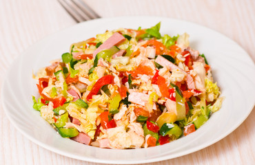 fresh salad with chicken, ham and vegetables