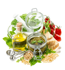 ingredients for fresh green pesto sauce on white background