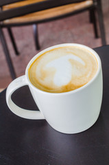 Latte on the black table