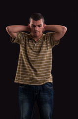 Fototapeta premium thinker and sad teenager with both hands behind his neck, emotio