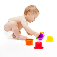 Cute infant boy with toys