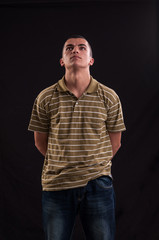 Obraz premium Teenager with a pensive expression looking up