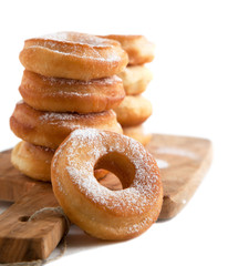 Fresh donuts with powder sugar isolated on white background. Sel
