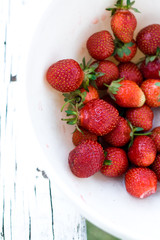 Ripe strawberry scented home in a white bowl