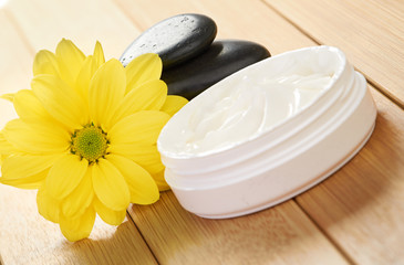 cosmetic cream with herbal flower