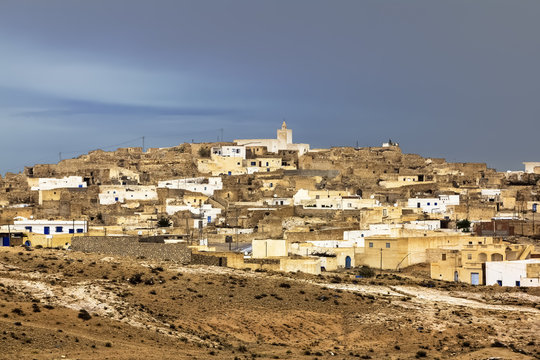 The town Matmata in Tunisia amid lightning sky