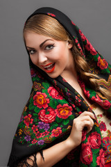 young woman in a headscarf in the Russian style.