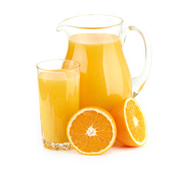 Jug, glass of orange juice and orange fruits