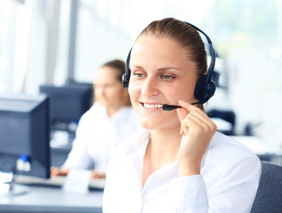 Beautiful young female call center operator