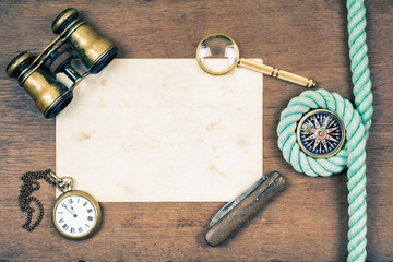 Binoculars, compass, paper, watches, knife, magnifying glass