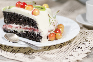 Slice of bird-cherry flour cake with cherries