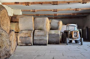Tractor and bale of straw