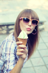 Young woman eating ice cream cone