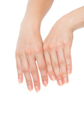 Beautiful woman hands with french manicure nails