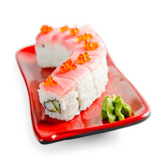 traditional fresh japanese sushi rolls on a white background
