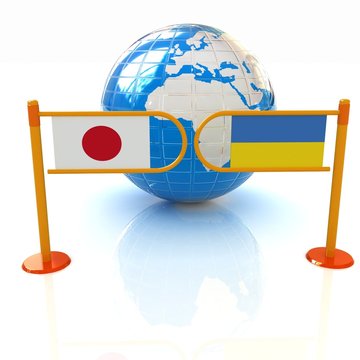 turnstile and flags of Japan and Ukraine on a white