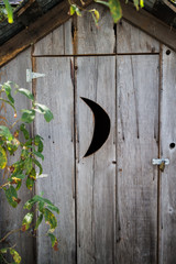 outhouse with crescent opening