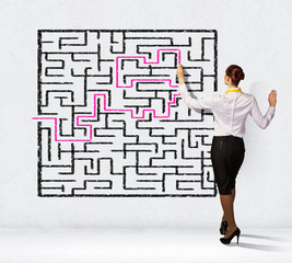 Businesswoman solving maze problem