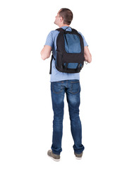 Fototapeta premium Back view of man with backpack looking up.
