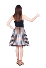 Naklejka premium Back view of woman thumbs up.