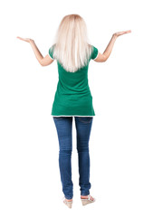Back view of happy woman in jeans