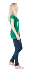 Fototapeta premium back view of walking woman.